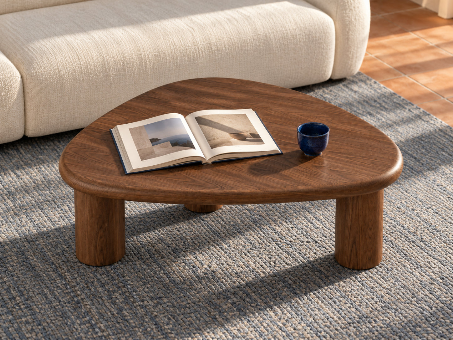 Walnut coffee table with a book and blue ceramic cup, illustrative room concept