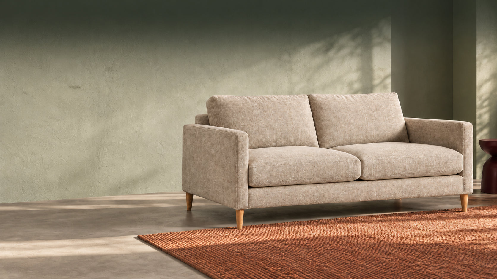 Ledge oatmeal sofa in a sage room, illustrative campaign image